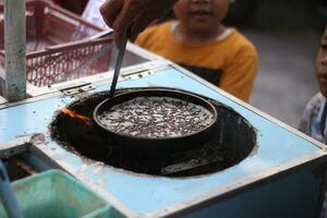 Make Leker cakes, a type of crepes, Indonesian traditional snack photo