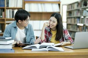 Young students campus helps friend catching up and learning. photo