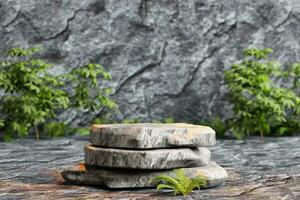 Stone podium with dark rocks background and green plants product display scene photo