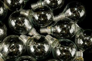 a pile of clear bulbs on a black background photo