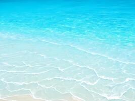 Light blue sea waves with transparent ocean water and light reflections on sandy beach. abstract Water Ripple texture, discounts. photo