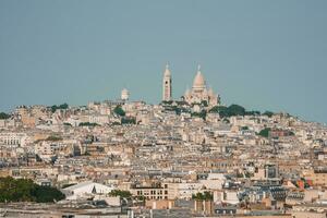 Sunny Paris Cityscape with The Basilica of the Sacred Heart of Paris photo