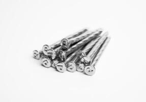 Pile Of Silver Shiny Sharp Metal Nails Closeup Photo Isolated On White Background