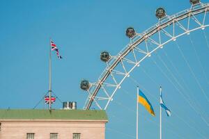 London Eye over Thames River in London. photo