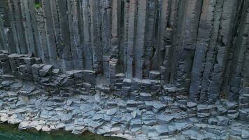 Aerial ascending view of Sudlagil canyon basalt columns in Iceland 4K 30p video