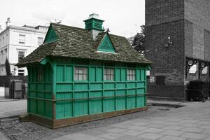 Color isolated green kiosk in London photo