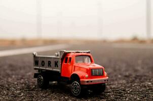 a toy truck on the road photo