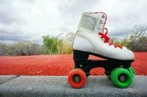 a roller skate on the cement photo