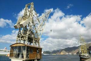 a large crane sitting on top of a dock photo