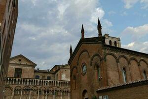 view of old buildings in a city with blue sky photo