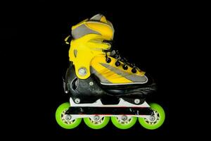 a roller skate on a black background photo