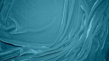 Blue velvet fabric texture used as background. Ocean color panne fabric background of soft and smooth textile material. crushed velvet .luxury navy tone for silk. photo