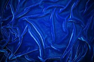 Dark bule velvet fabric texture used as background. Sky color panne fabric background of soft and smooth textile material. crushed velvet .luxury cobalt tone for silk. photo