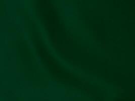 Green velvet fabric texture used as background. Peacock color panne fabric background of soft and smooth textile material. crushed velvet .luxury emerald tone for silk. photo