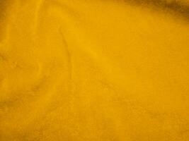 Yellow velvet fabric texture used as background. Empty yellow fabric background of soft and smooth textile material. There is space for text. photo