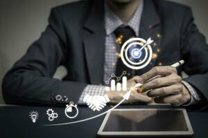 Businessman with icon business and network connection on modern virtual interface from digital marketing success. Person touching on tablet startup thinking concept . photo