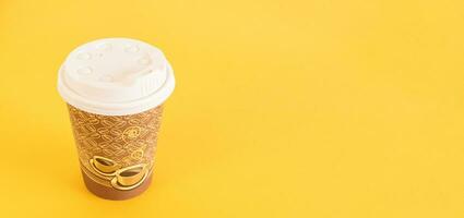Top view of disposable coffee cups. Paper cups. On pastel yellow background photo