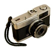 Retro film photo camera, isolated on white background.