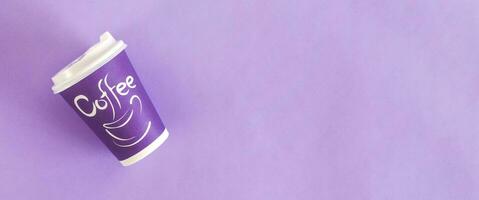 Top view of disposable coffee cups. Paper cups. On pastel violet background photo