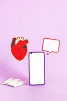 Smart phone and heart health insurance, world heart day, world health day. photo