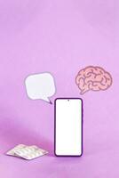 Brain paper cutout and smart phone. Epilepsy and alzheimer awareness, seizure disorder, mental health concept. photo