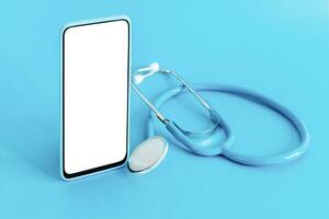 Smart phone and stethoscope on light blue background. Doctor online. Online medical app. photo