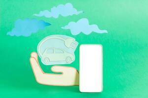 Green electric car paper cut eco friendly concept. photo