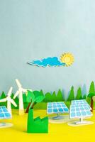 Sustainable power from solar panels and wind turbines, paper cut, paper art. photo