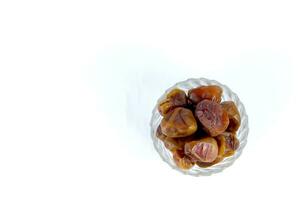 Pile of tasty dry dates isolated on white background photo