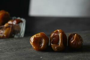 Pile of tasty dry dates isolated on white background photo