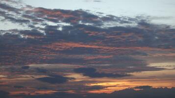 Golden clouds in the evening day with sunsets photo