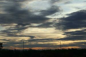 Golden clouds in the evening day with sunsets photo