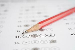 Answer sheets with pencil drawing fill to select choice, education concept. photo