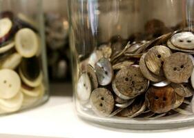 Jars of Vintage Buttons on Display in a Boutique photo