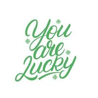 You are Lucky hand written lettering with clover quatrefoil. Modern calligraphy quote, phrase. Vector Illustration.