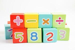 Number wood block cubes for learning Mathematic, education math concept. photo