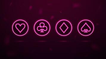 A set of neon symbols of playing cards in bright circles for the casino. vector