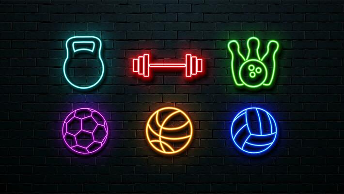 A set of neon icons a football ball, a volleyball ball, a basketball ball, a kettlebell, dumbbells and bowling pins with a bowling ball on a wall background.