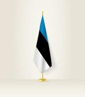 Estonia bandera en un bandera pararse. vector