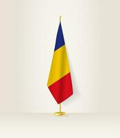 Rumania bandera en un bandera pararse. vector