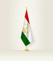 Tajikistan flag on a flag stand. vector