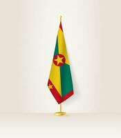 Grenada flag on a flag stand. vector