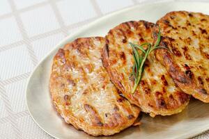 tteokgalbi, korean Grilled Short Rib Patties, Minced beef rib meat seasoned with garlic and soy sauce, molded around the bone and chargrilled while brushing with a soy sauce mixture. photo