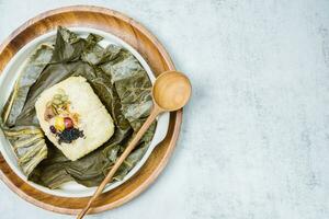 yeonnipbap, korean lotus leaf rice, Glutinous rice, dates, and chestnuts wrapped in a lotus leaf and steamed in a steamer. In the past, this dish was made and consumed by Buddhist monks, photo