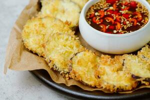 fried eggplant, Flatten the eggplant and dredge in the tempura flour, shaking off any excess. Mix the tempura flour, egg, and water to make a tempura batter. Once the oil is hot, photo