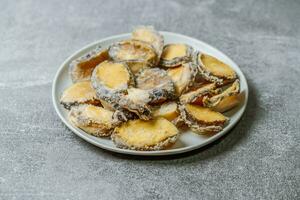 Seafood on a plate raw abalone photo