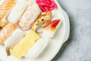 Fresh Japanese food sushi dishes on white plates photo