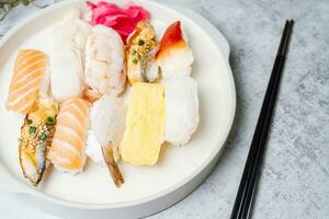 Fresh Japanese food sushi dishes on white plates photo