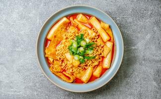 Rabokki, Korean style Stir-fried Instant Noodle, This dish is tteokbokki with ramen noodles. Tteokbokki is a spicy dish made with rice cake, vegetables, and fish cake photo