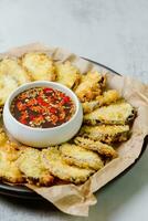 fried eggplant, Flatten the eggplant and dredge in the tempura flour, shaking off any excess. Mix the tempura flour, egg, and water to make a tempura batter. Once the oil is hot, photo